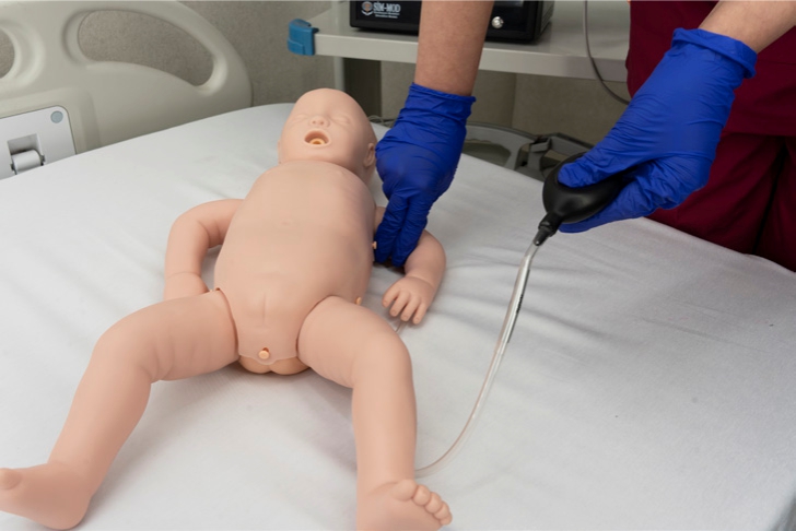 3 Infant BLS manikin showing real-time CPR performance reporting screen on tablet