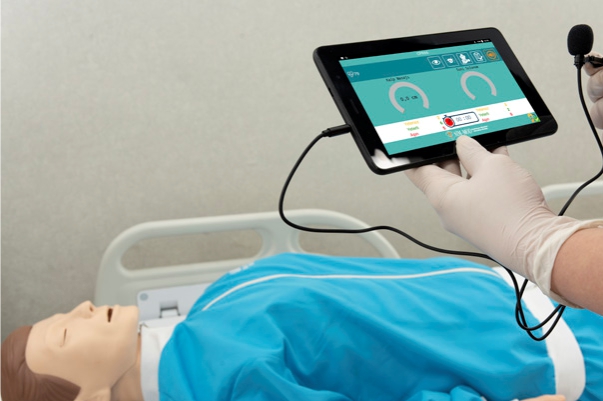 4 CPR manikin controller showing feedback lights for compression depth and ventilation