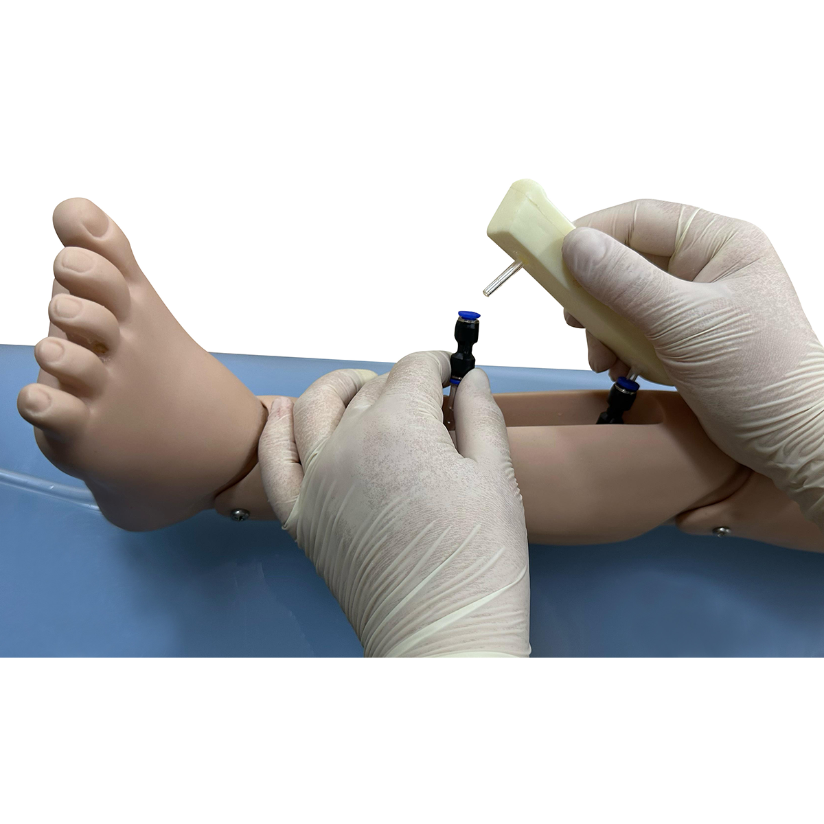 st155-3 Pediatric IO training leg showing tibia needle insertion and bone marrow aspiration